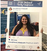 Presenter Hilary Hullinger in San Diego, CA, with OJJDP&rsquo;s Tribal Youth Training and Technical Assistance Center 2018 National Unity Conference Instagram cutout.