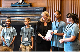 Administrator Harp commends Do The Write Thing Challenge national student ambassadors—pictured from left Talayia R., Justin H., Brian J., and Heaven J.—July 16, 2018, in Washington, DC. Photo courtesy of the National Campaign to Stop Violence.