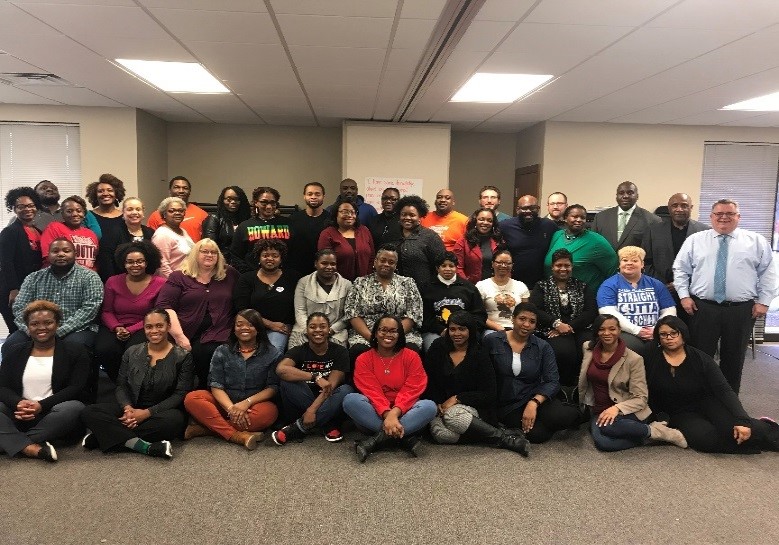 Photo of school personnel who participated in a training program on mitigating the effects of exposure to violence and trauma.